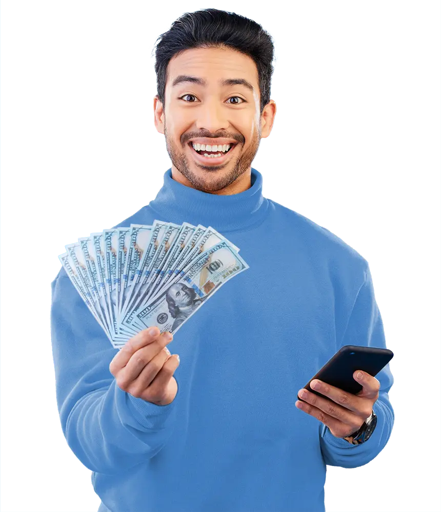 Young man smiling after getting a loan on his phone